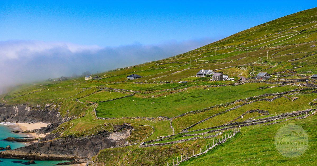 Aerial view of green hills and rocky coastline on the Dingle Peninsula, Ireland