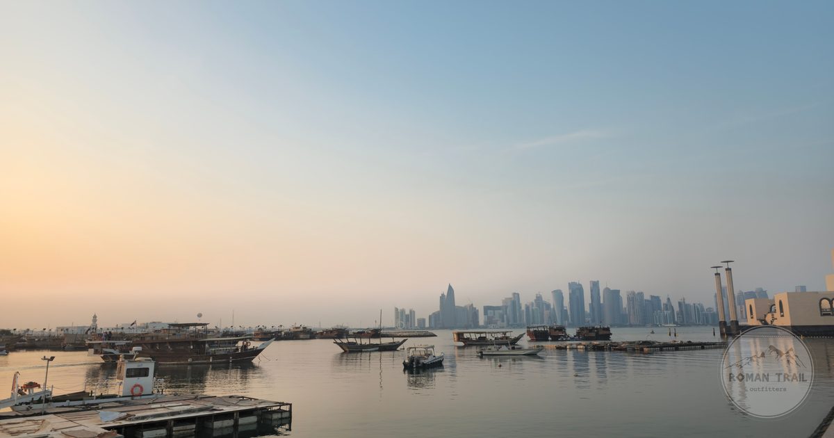 Doha skyline from the Corniche with traditional dhow boats, Qatar
