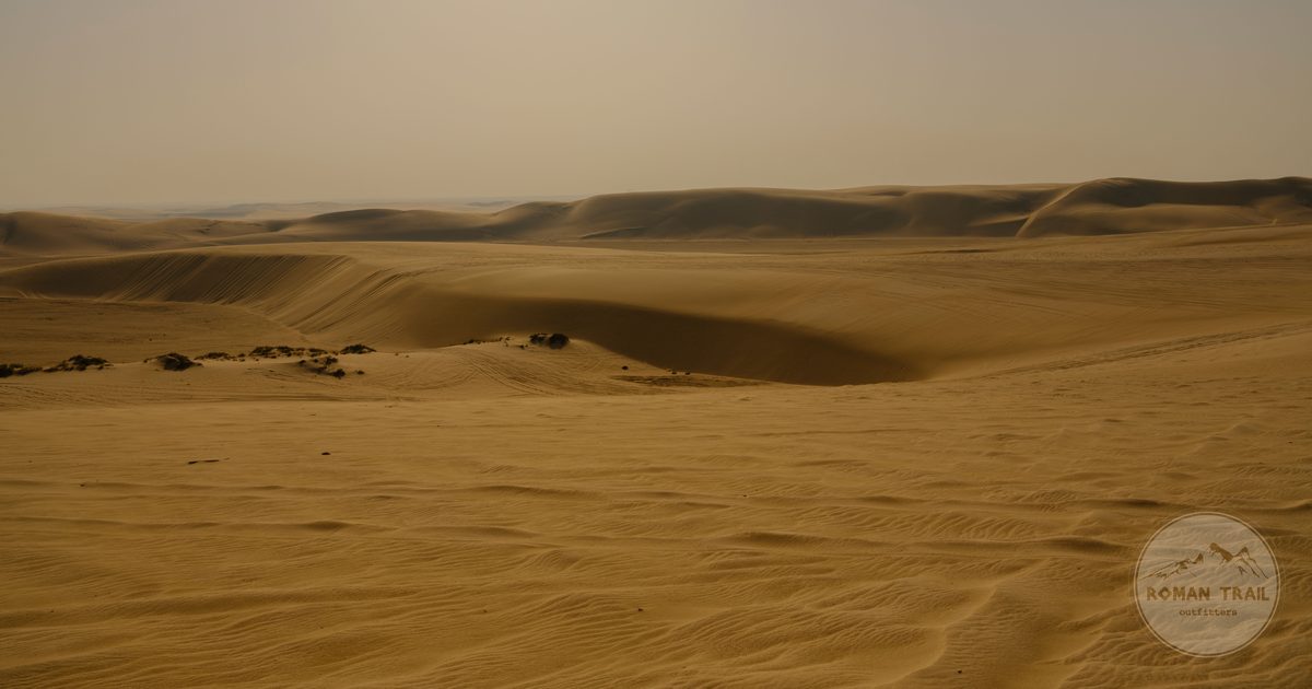 Golden sand dunes in the desert near Doha, Qatar