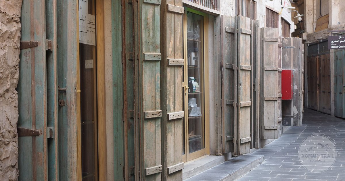 Traditional alleyway with wooden doors in Souq Waqif, Doha, Qatar