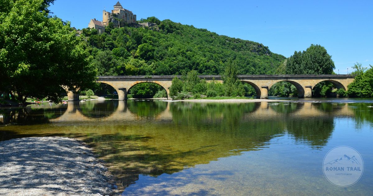 Castelnaud-la-Chapelle castle reflected in the Dordogne river, France