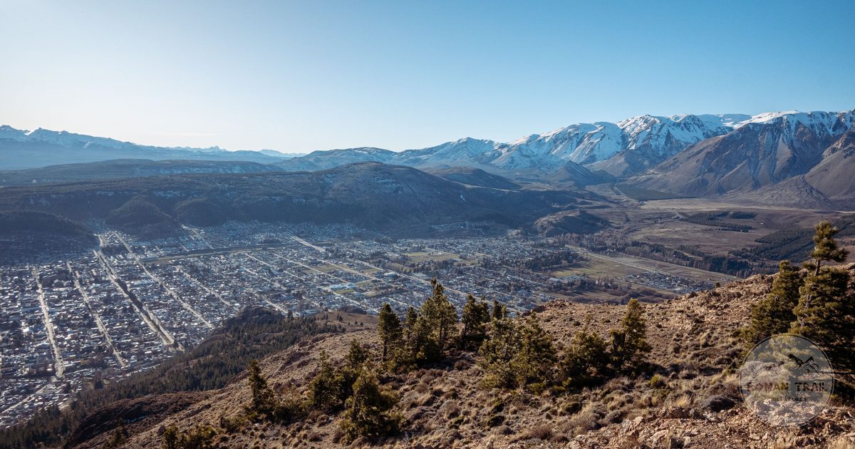 Panoramic view of Esquel, Argentina, below snow capped mountains