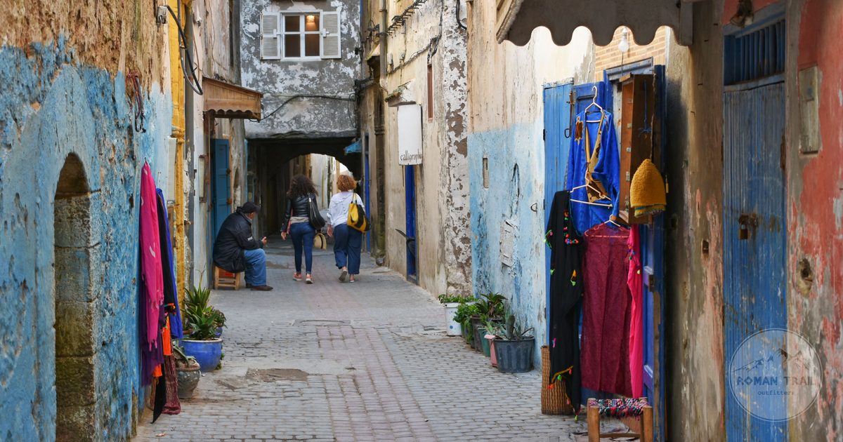Narrow whitewashed alley with blue doors in the Essaouira medina, Morocco