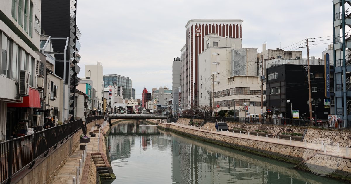 A canal through central Fukuoka flanked by modern architecture, Japan