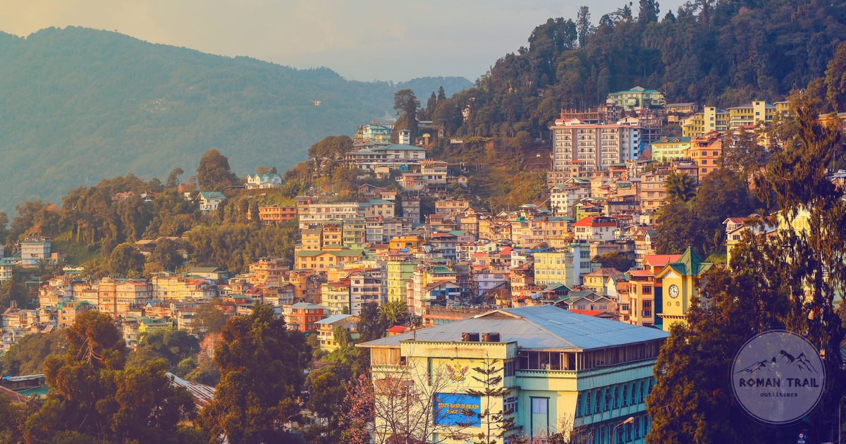 Gangtok at sunset with the hillside town and the mountains behind, Sikkim, India