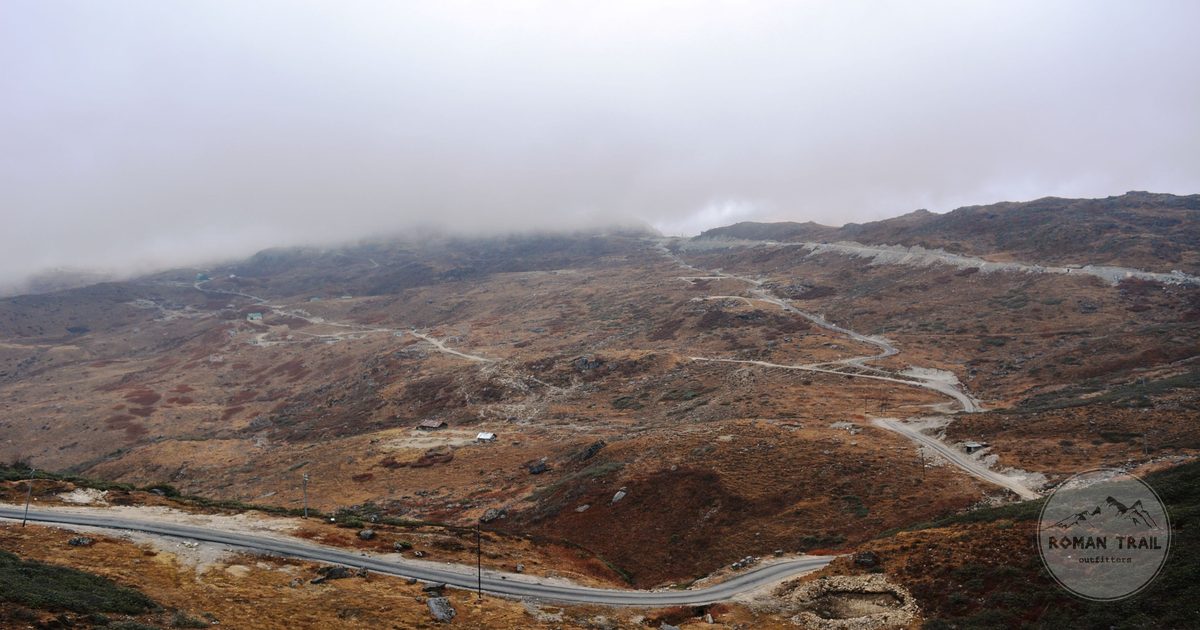 A winding road through mist covered mountains at Gangtok, Sikkim, India