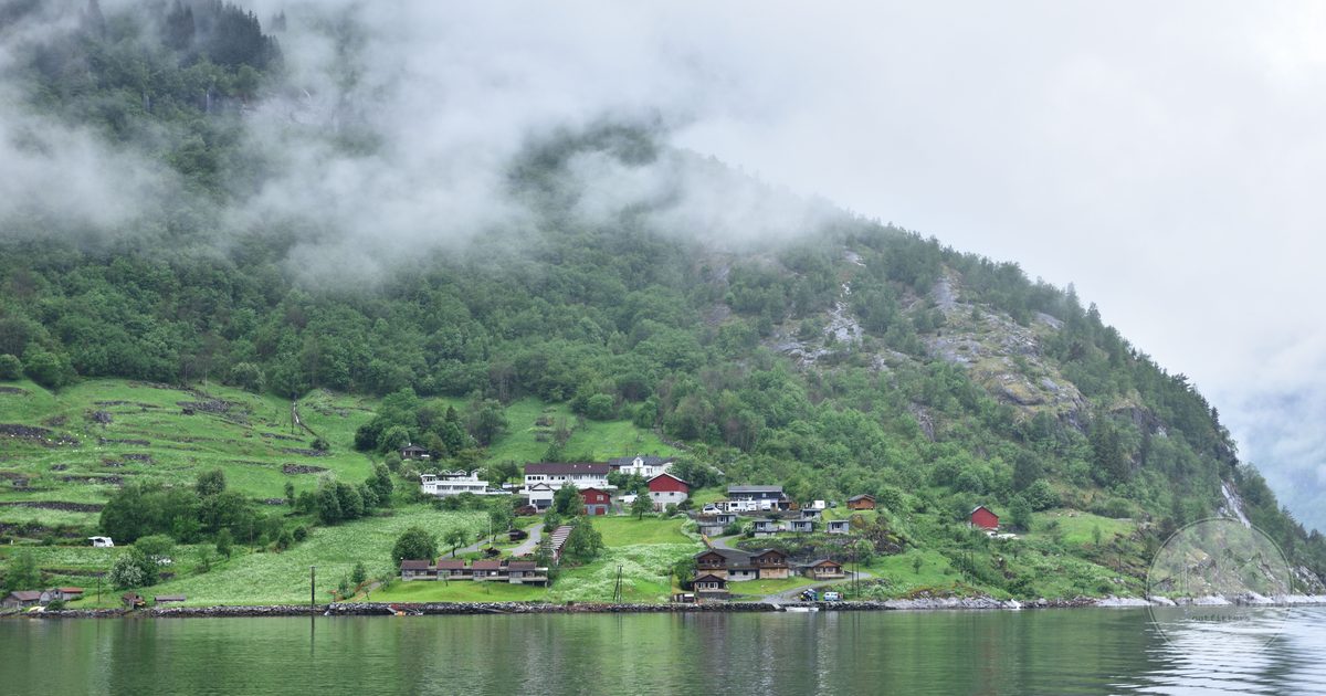 The village of Geiranger among misty hills at the head of the fjord, Norway