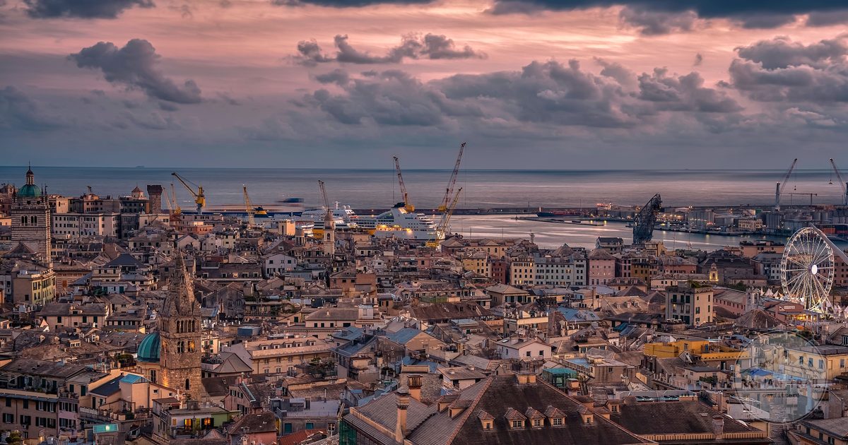 Aerial view of Genoa and its harbour at sunset, Genoa packing list for women by Roman Trail Outfitters
