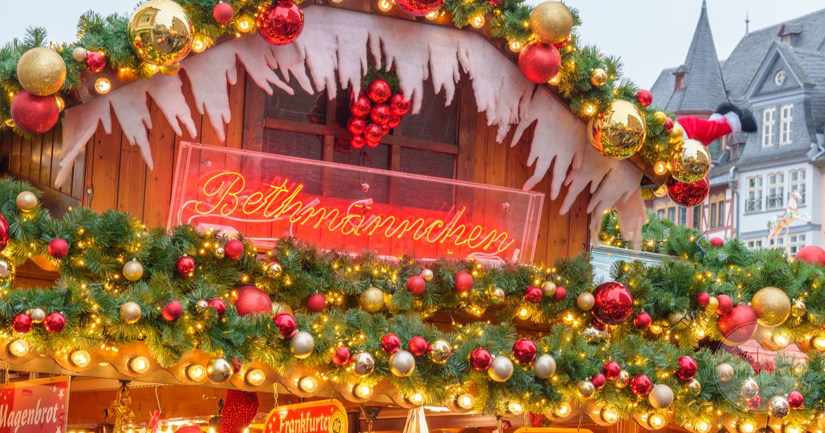 Illuminated Christmas market stall with holiday decorations, Germany