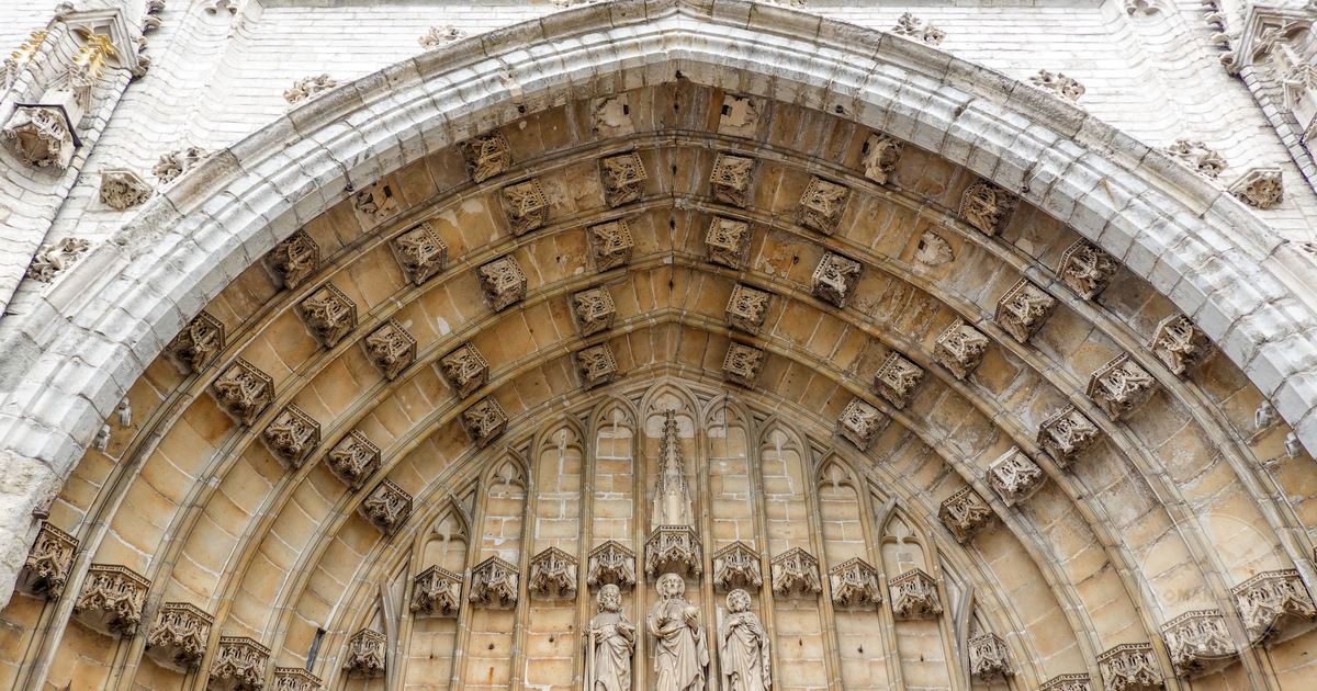 The Gothic facade of Saint Bavo Cathedral in Ghent, Belgium