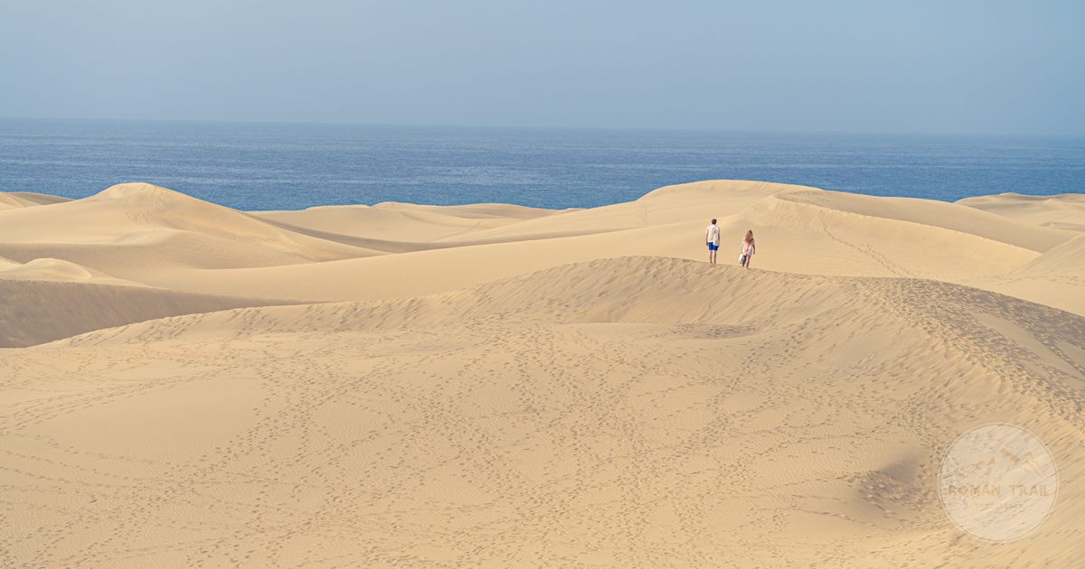 The Maspalomas dunes meeting the sea in southern Gran Canaria, Gran Canaria packing list for women by Roman Trail Outfitters