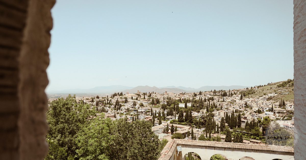 Panoramic view of the Granada cityscape framed by historic architecture