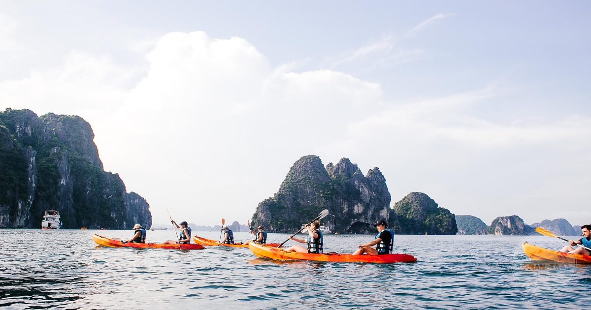 Kayakers among the limestone karsts of Ha Long Bay, Vietnam