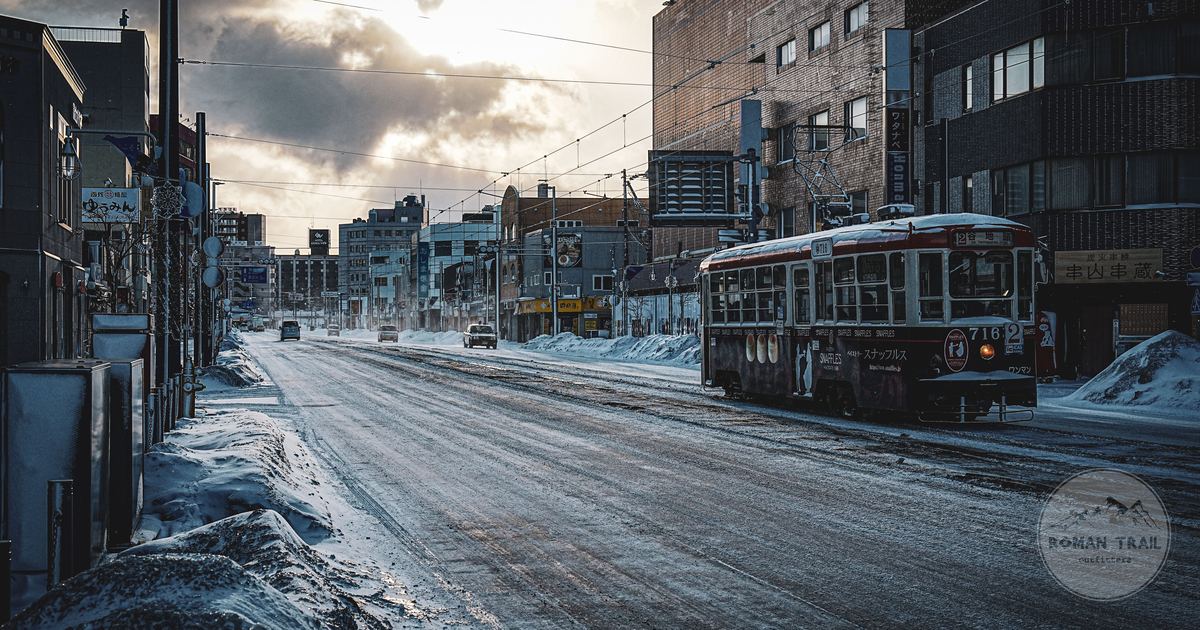 A vintage streetcar on a snowy street in winter at Hakodate, Japan