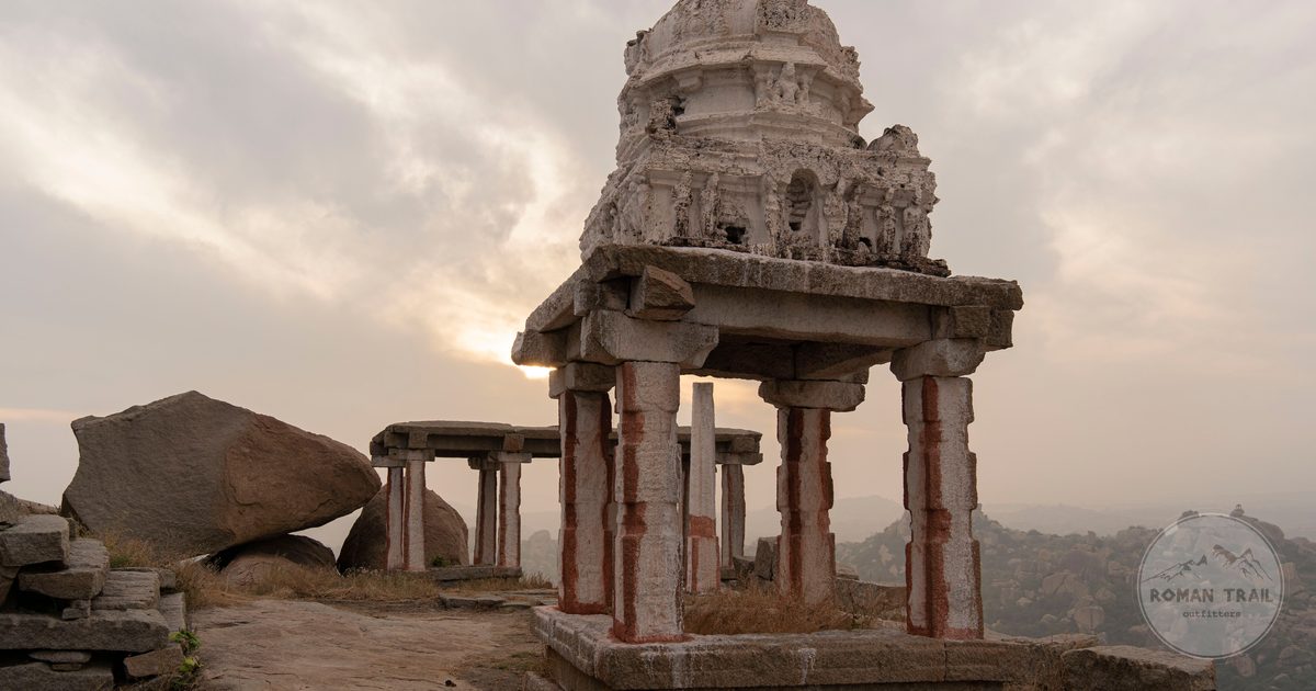 Sunrise over the temple ruins and boulder landscape at Hampi, Hampi packing list for women by Roman Trail Outfitters