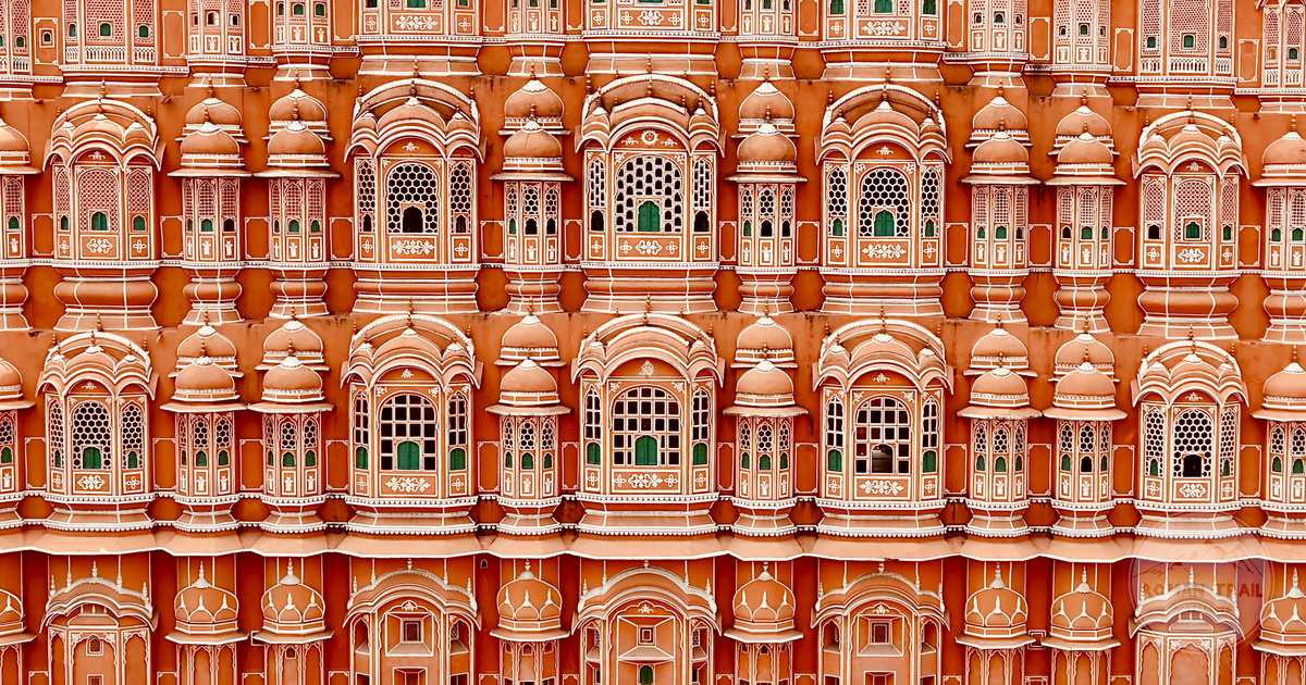 The pink sandstone facade of the Hawa Mahal in Jaipur, India
