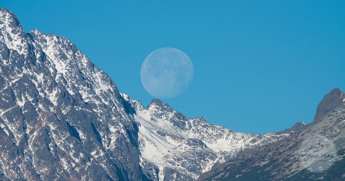 Snow-capped High Tatras peaks with the moon above, Slovakia