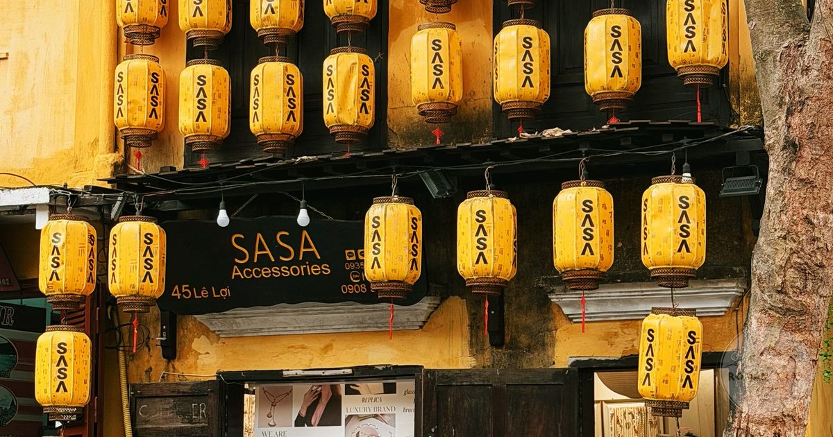 Yellow silk lanterns on a historic Ancient Town shopfront, Hoi An for women travelers