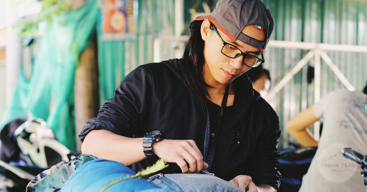 A traveller packing backpacks before a trip