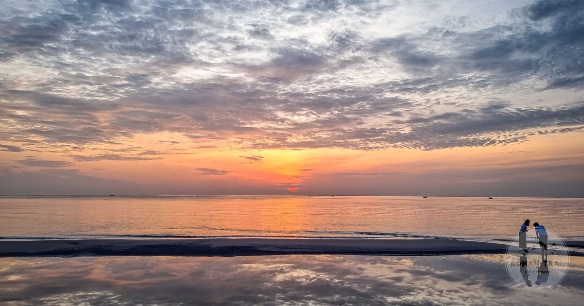 Sunrise over the calm water at Hua Hin beach, Thailand