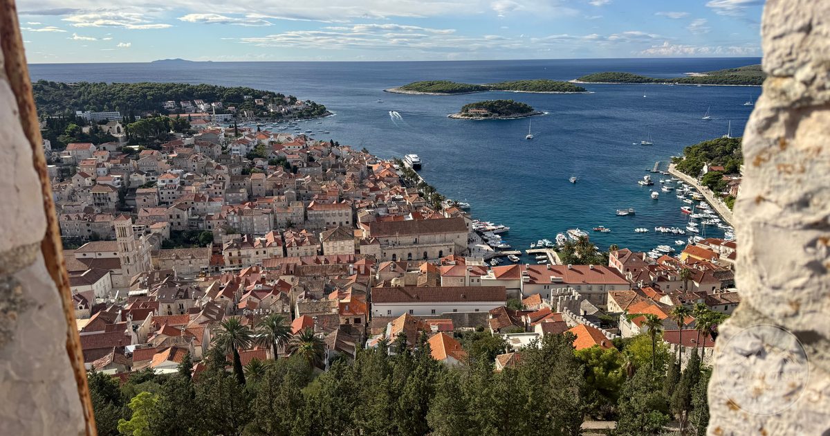Aerial view of Hvar Town over the Adriatic with islands and yachts, Croatia