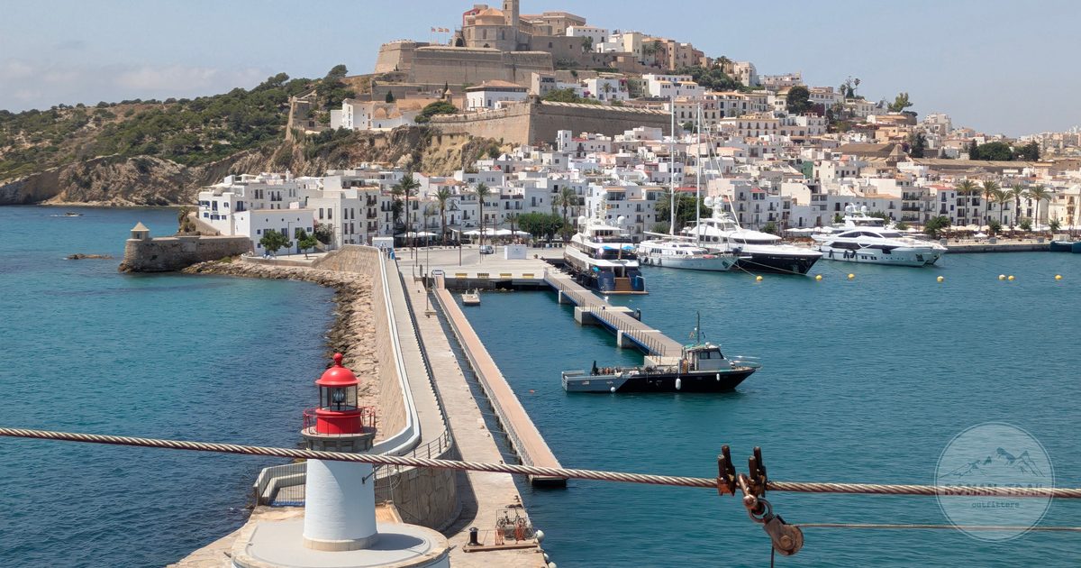 Ibiza harbour with the walled old town of Dalt Vila above it, Ibiza packing list for women by Roman Trail Outfitters