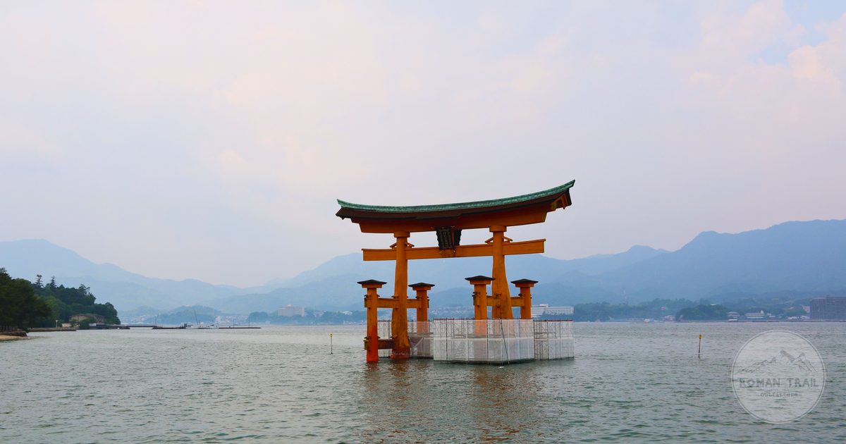 Torii gate standing in the water at Itsukushima Shrine, Hiroshima Bay Japan