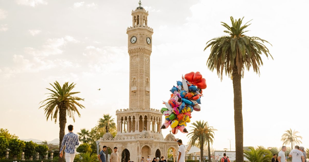 People at the Izmir Clock Tower on a sunny day, Turkiye