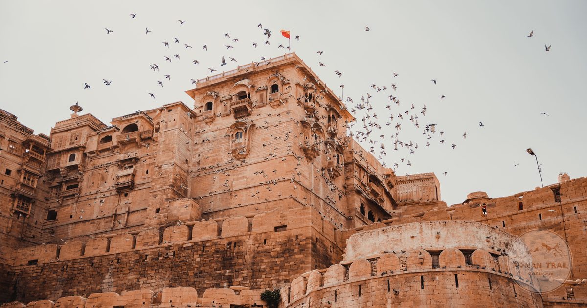 Jaisalmer Fort with birds above the sandstone walls, Rajasthan, India
