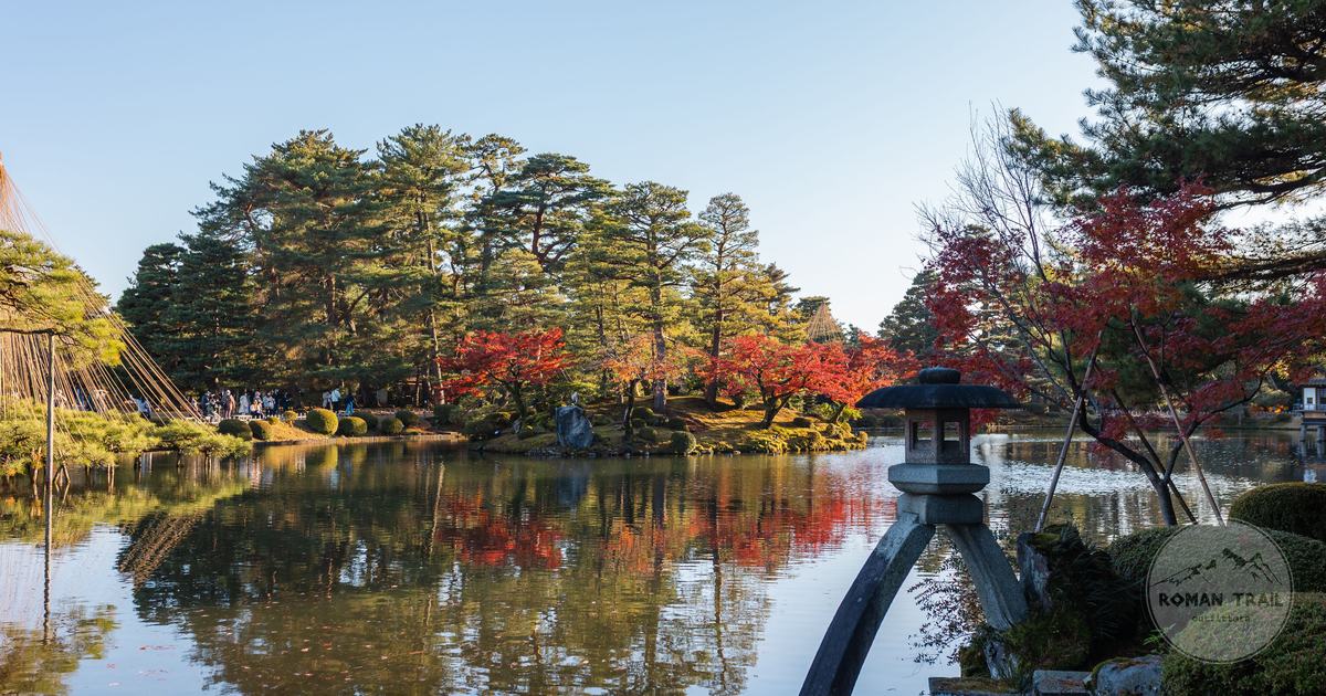 Autumn colour across the ponds and pines of Kenrokuen garden in Kanazawa, Kanazawa packing list for women by Roman Trail Outfitters