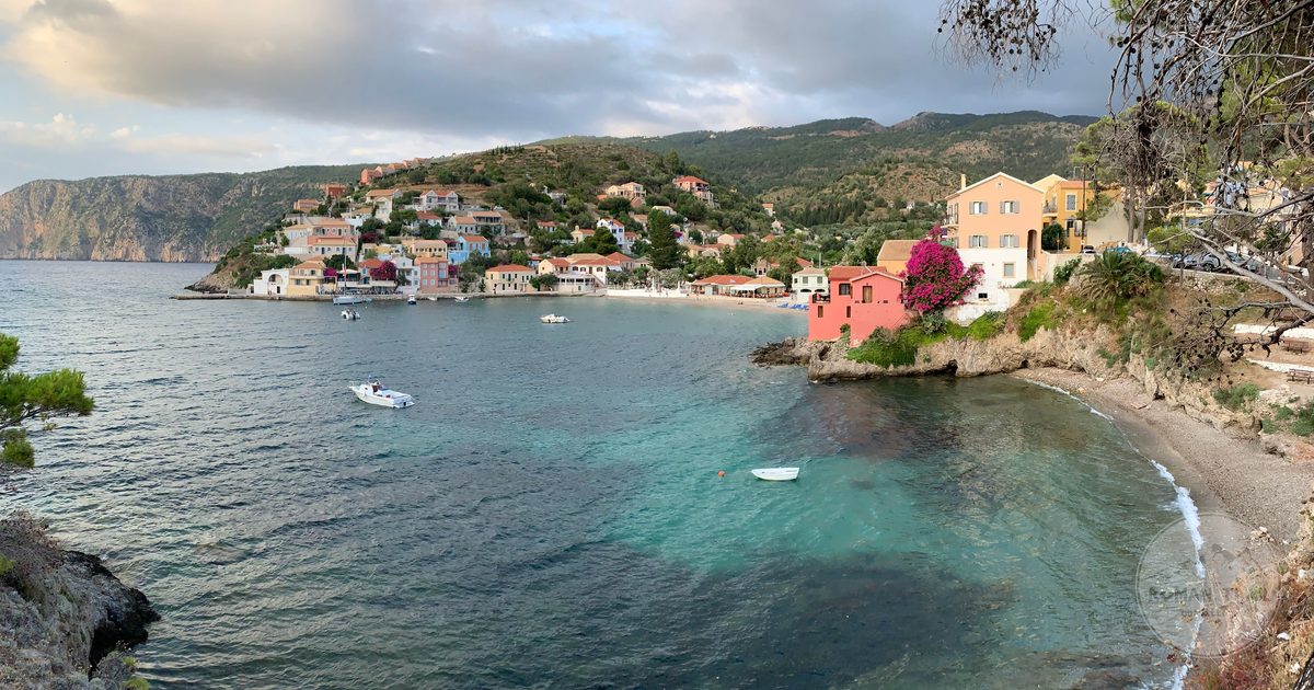 The village of Asos on its headland above the sea in Kefalonia, Kefalonia packing list for women by Roman Trail Outfitters