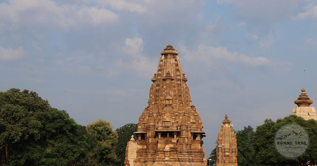 A Khajuraho temple surrounded by greenery, Madhya Pradesh, India