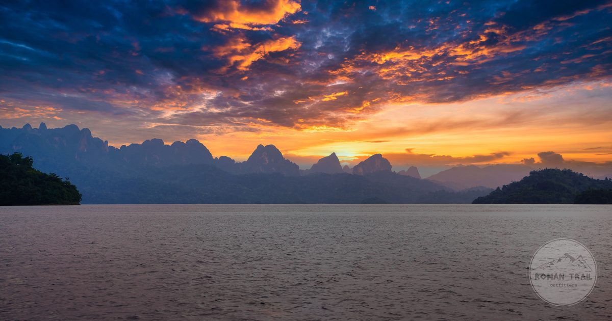 Sunset over the mountains and lake at Khao Sok, Thailand