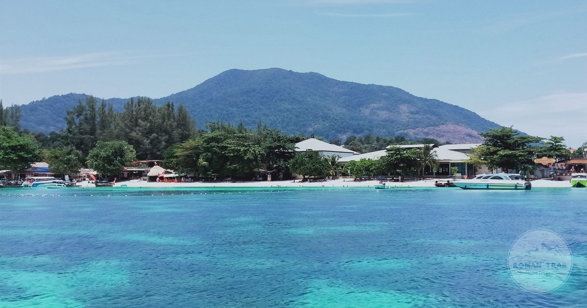 Clear water below green hills in Satun province, Thailand