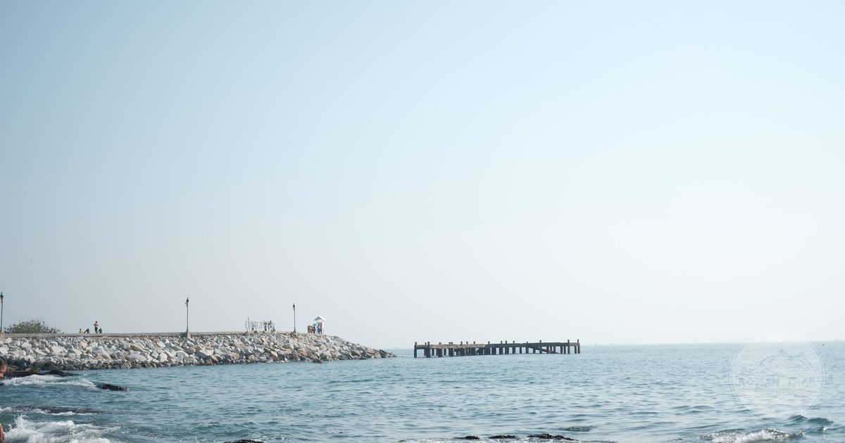 The pier and rocky shore at Phe, Rayong, Thailand