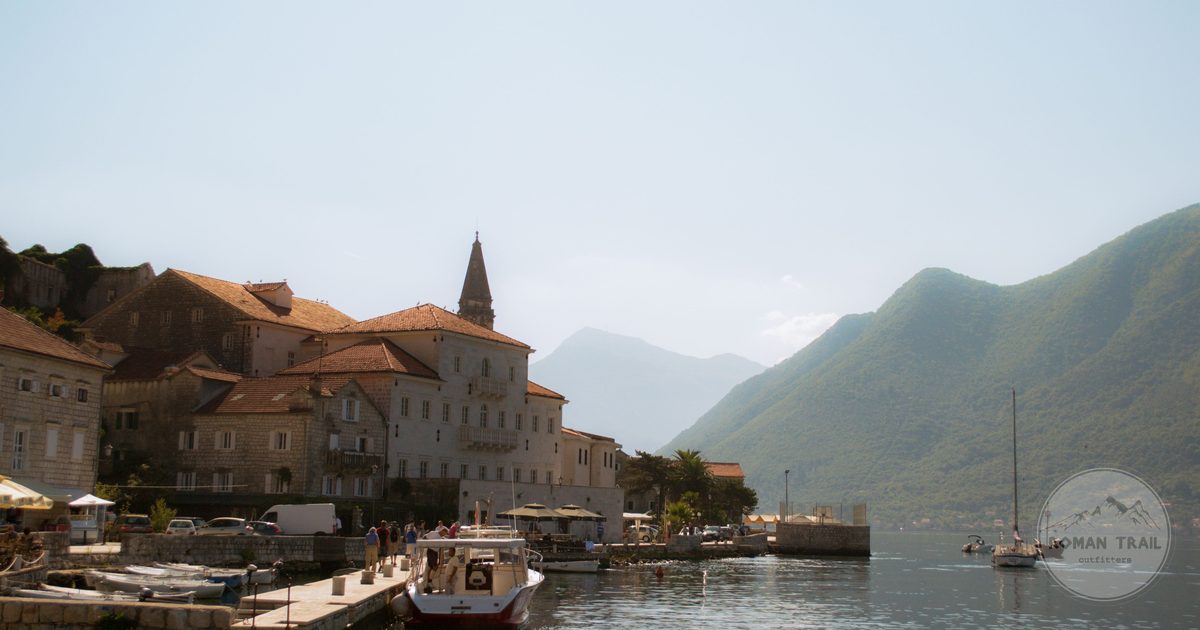 Perast harbour with boats below the mountains, Bay of Kotor, Montenegro