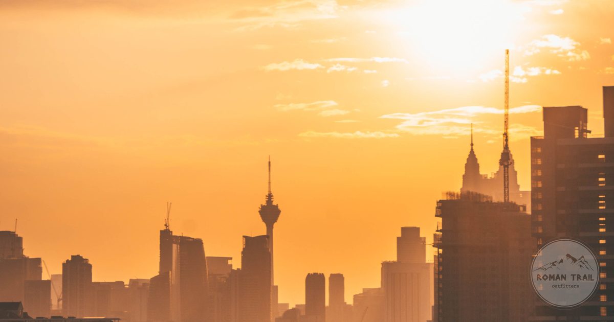 Kuala Lumpur skyline silhouetted in warm haze at sunset, Kuala Lumpur for women travelers