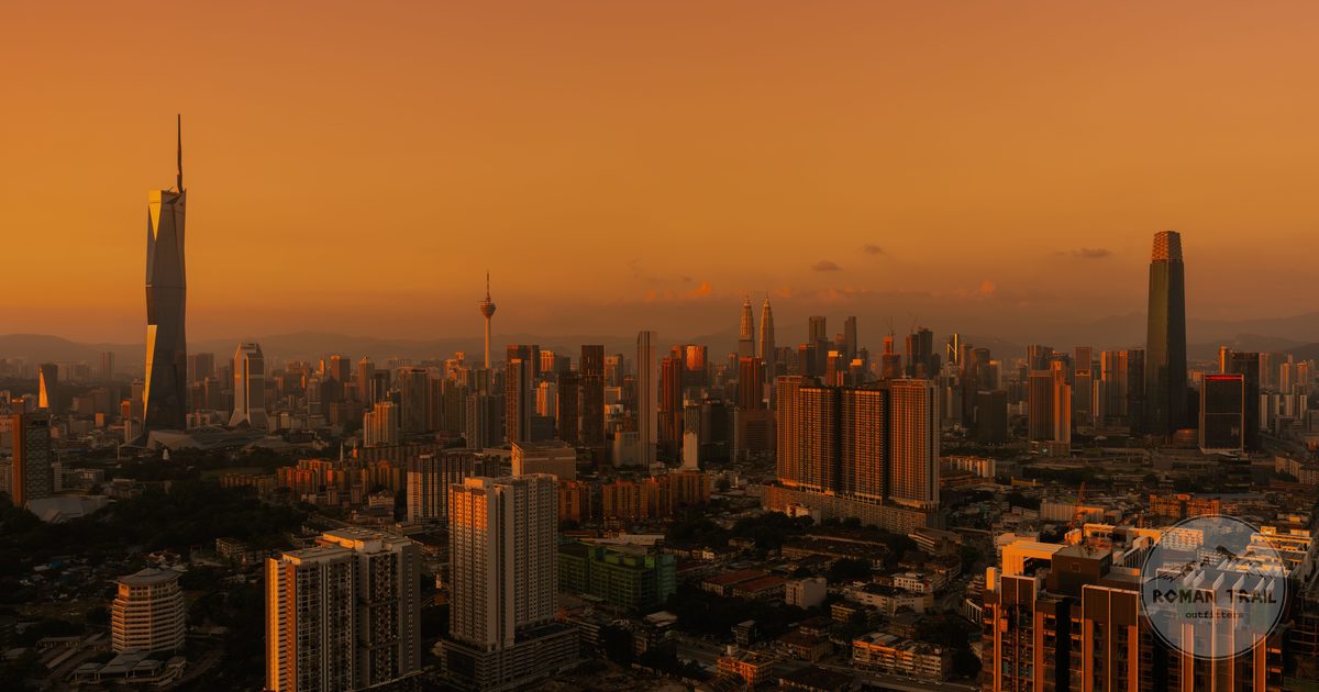 Golden light over the Kuala Lumpur cityscape at dusk, Kuala Lumpur travel guide for women by Roman Trail Outfitters