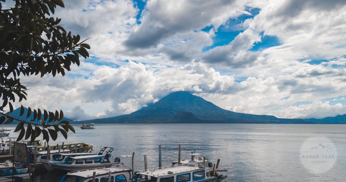 Boats docked below the volcano on Lake Atitlan, Guatemala