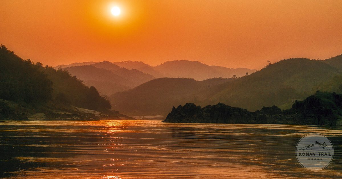 Golden hour over the Mekong River in Laos, Laos travel guide for women by Roman Trail Outfitters