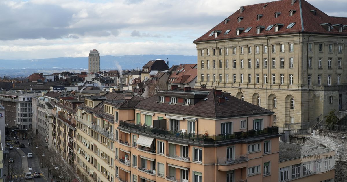 Historic rooftops and towers across the old town of Lausanne, Lausanne packing list for women by Roman Trail Outfitters