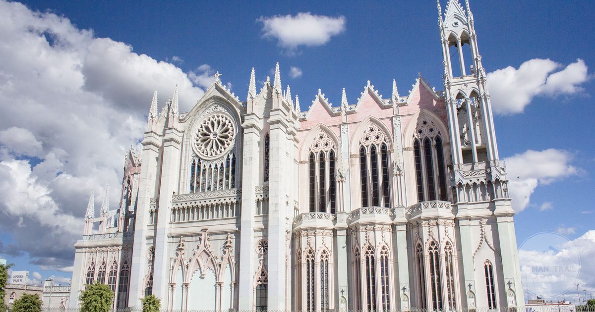 The neo-Gothic facade of the Expiatory Temple against a blue sky in Leon, Mexico
