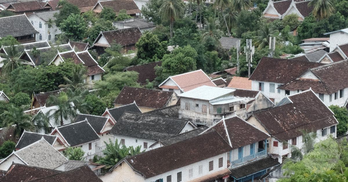 Aerial view of Luang Prabang traditional rooftops among palms, Luang Prabang travel guide for women by Roman Trail Outfitters