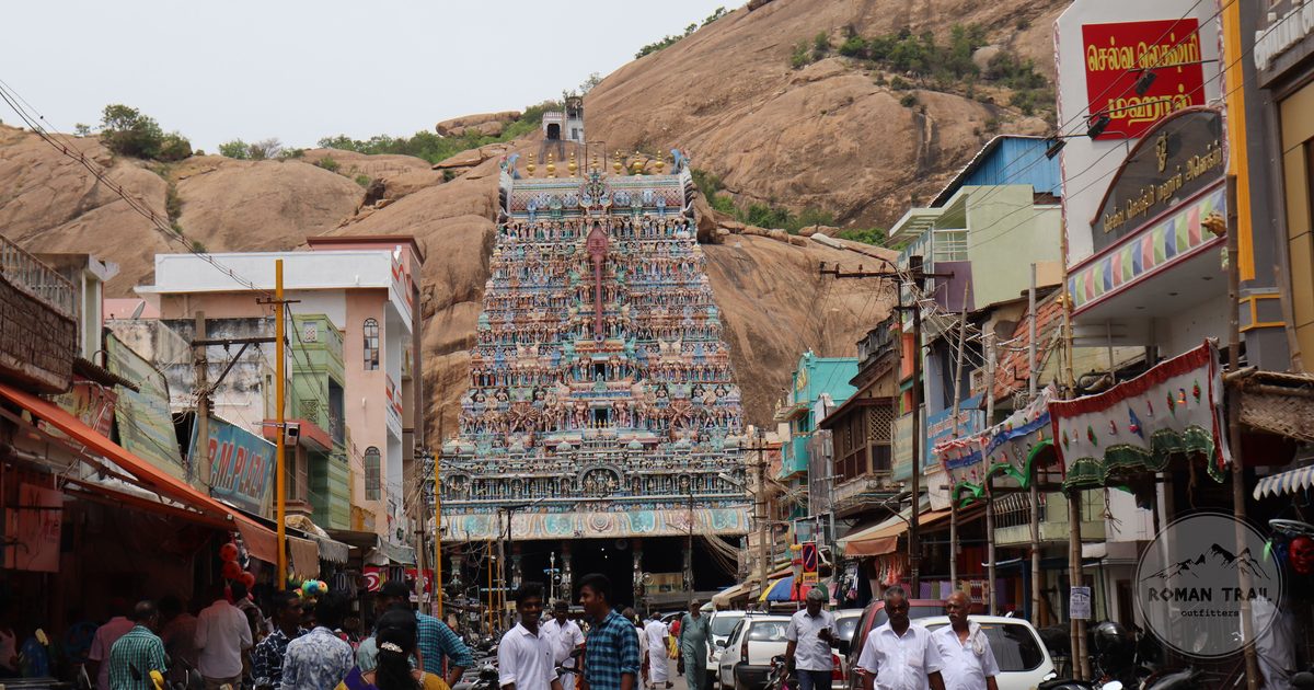 A street in Madurai with a richly decorated temple behind, Tamil Nadu, India