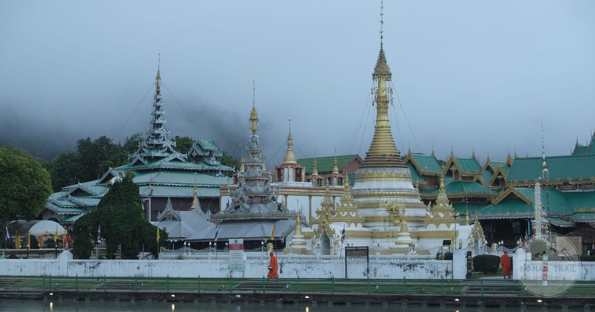 Wat Chong Kham reflected in the pond in mist at Mae Hong Son, Thailand