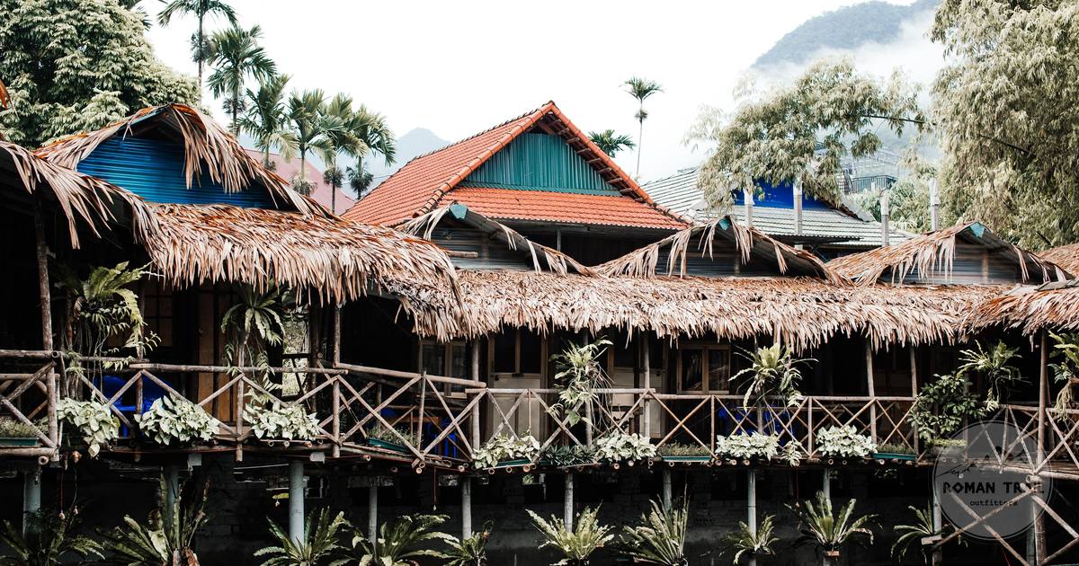 Stilt houses with thatched roofs above water, Vietnam