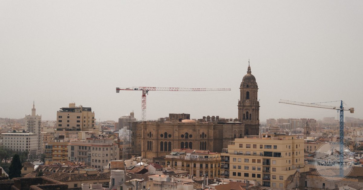 Malaga cathedral rising above the rooftops of the old town, Malaga packing list for women by Roman Trail Outfitters