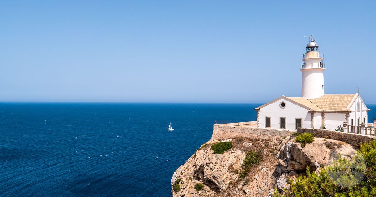 Lighthouse on the rugged Mallorca coastline above the Mediterranean, Spain