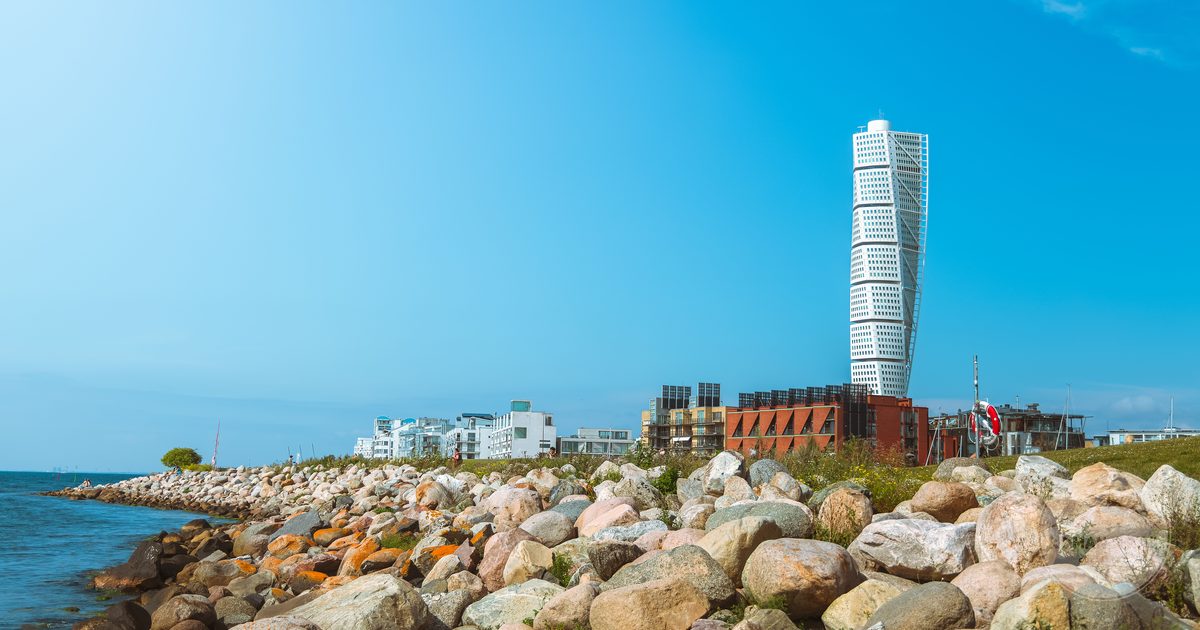 The Turning Torso tower beside the rocky coastline at Malmö, Sweden