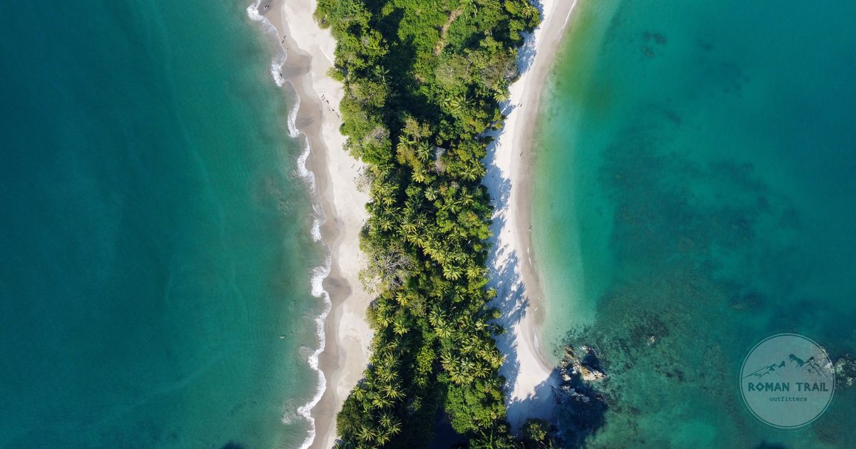 Aerial view of Manuel Antonio beach, forest and turquoise water, Costa Rica